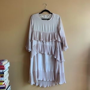 Pale pink layered chiffon-style dress.